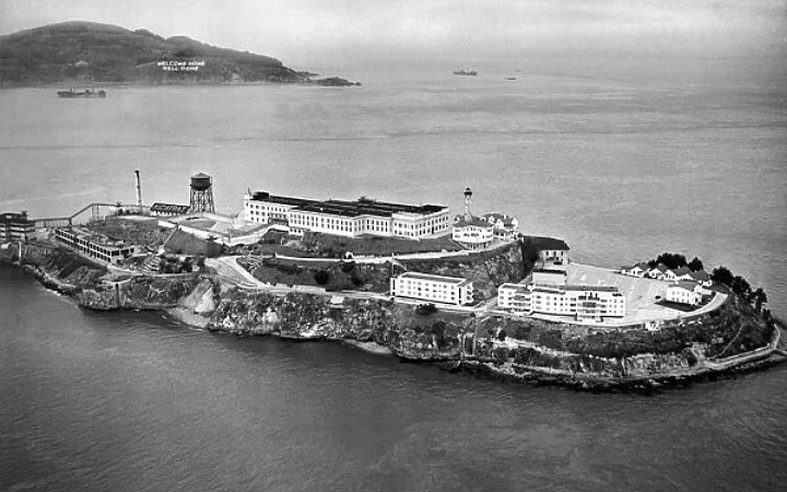 Aerial view of Alcatraz Island surrounded by water, emphasizing its remote and secure location.