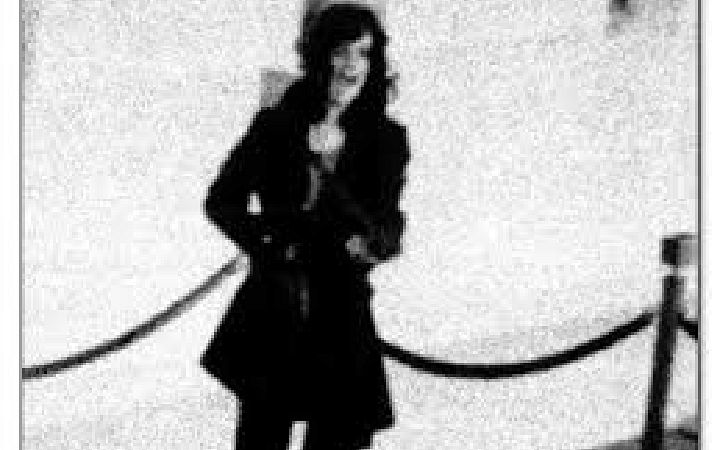 Patty Hearst during the Hibernia Bank robbery, brandishing a machine gun