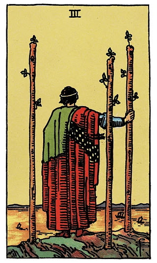 3 of Wands tarot card from the Rider–Waite deck, depicting a figure standing on a cliff with three wands, gazing at ships in the distance