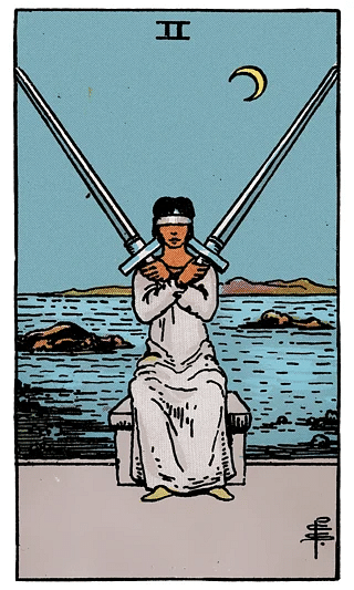 2 of Swords tarot card from the Rider–Waite deck, showing a blindfolded figure holding two crossed swords, seated by a calm sea