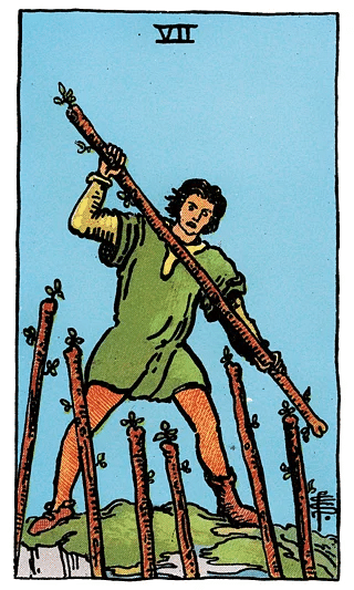 7 of Wands tarot card from the Rider–Waite deck, featuring a figure on higher ground defending against six oncoming wands