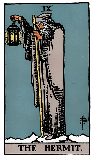 The Hermit tarot card from the Rider–Waite deck, featuring an elderly figure holding a lantern and staff atop a mountain